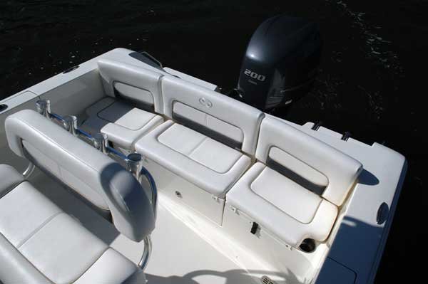 The definition of an outboard motor is a detachable engine mounted on outboard brackets on the stern of your boat.  This configuration will have only one single engine.